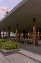 A welcoming pavilion-style outdoor seating area bathed in soft natural light.