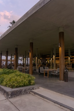 A welcoming pavilion-style outdoor seating area bathed in soft natural light.