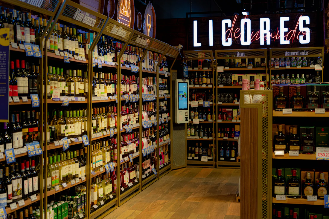 Liquor store shelves filled with bottles of wine and spirits