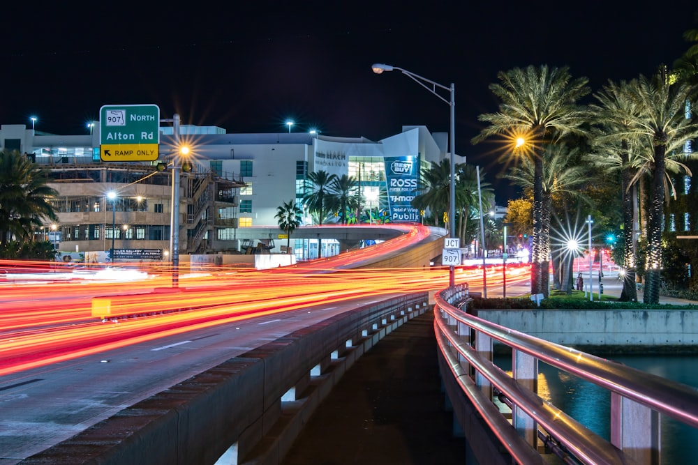 a city street filled with lots of traffic at night