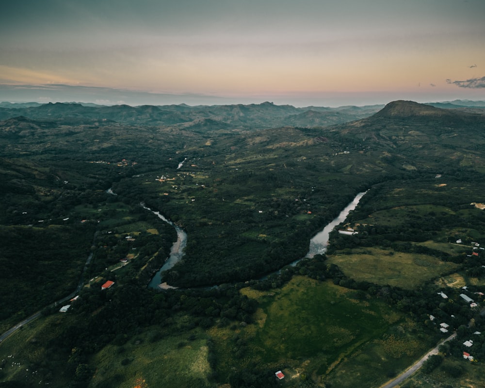 an aerial view of a river running through a valley