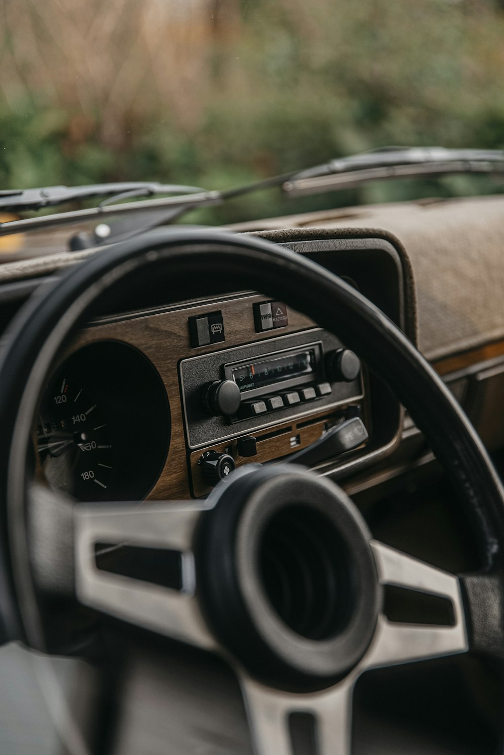 a dashboard of a car with a steering wheel