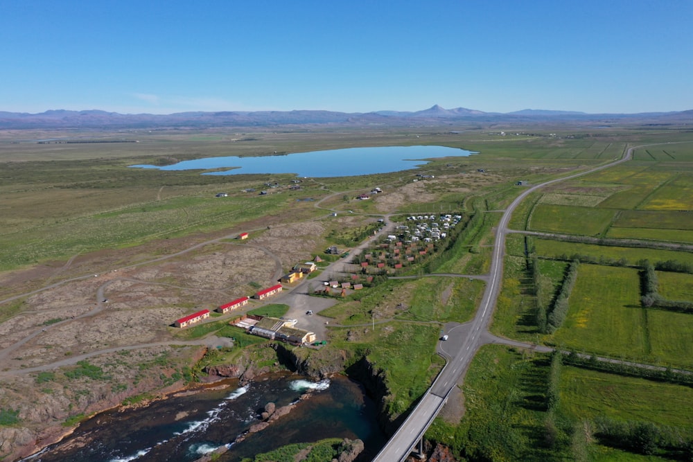 an aerial view of a road and a river