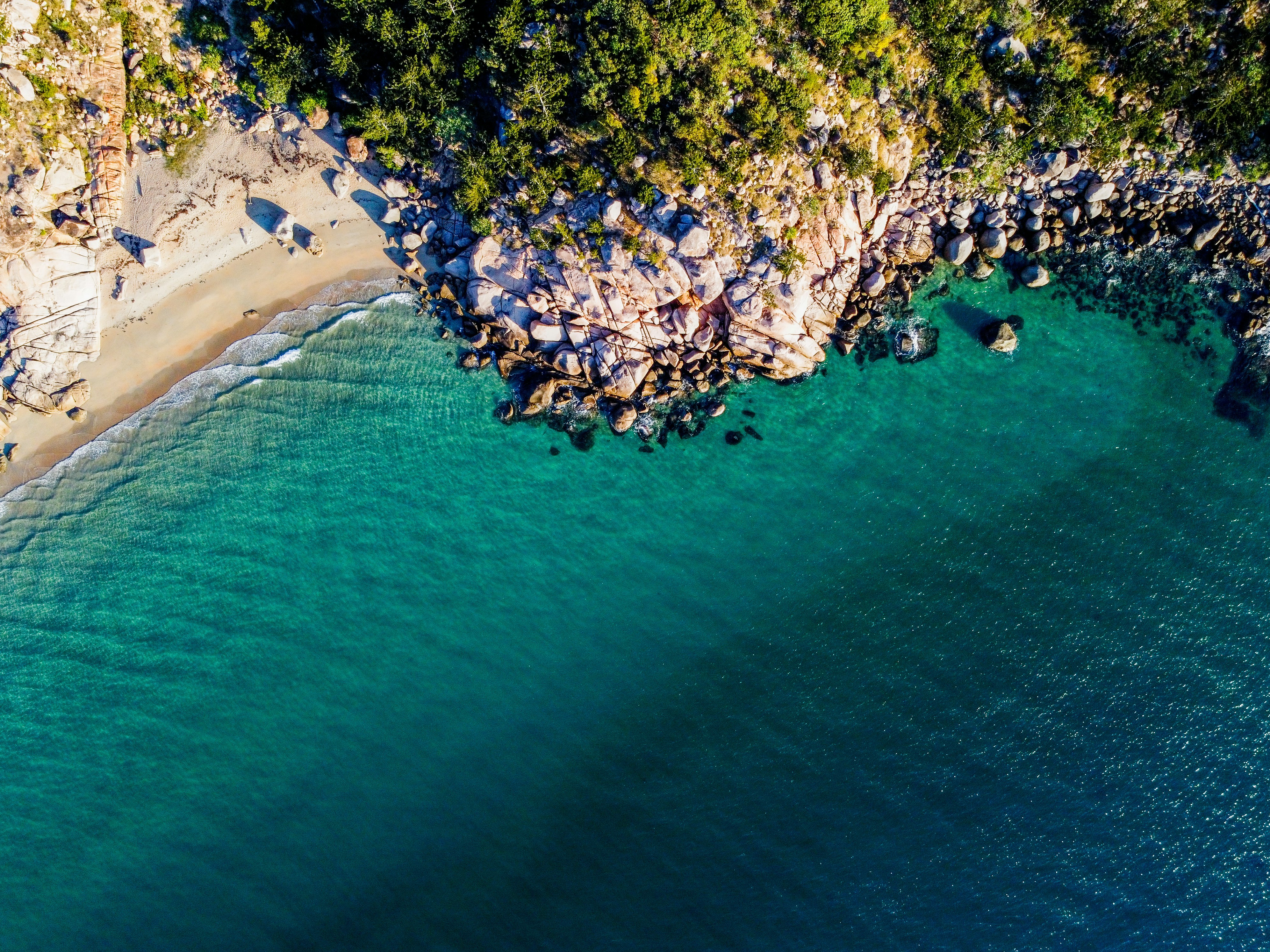 a bird's eye view of a beach and a body of water