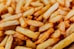 a pile of french fries sitting on top of a table