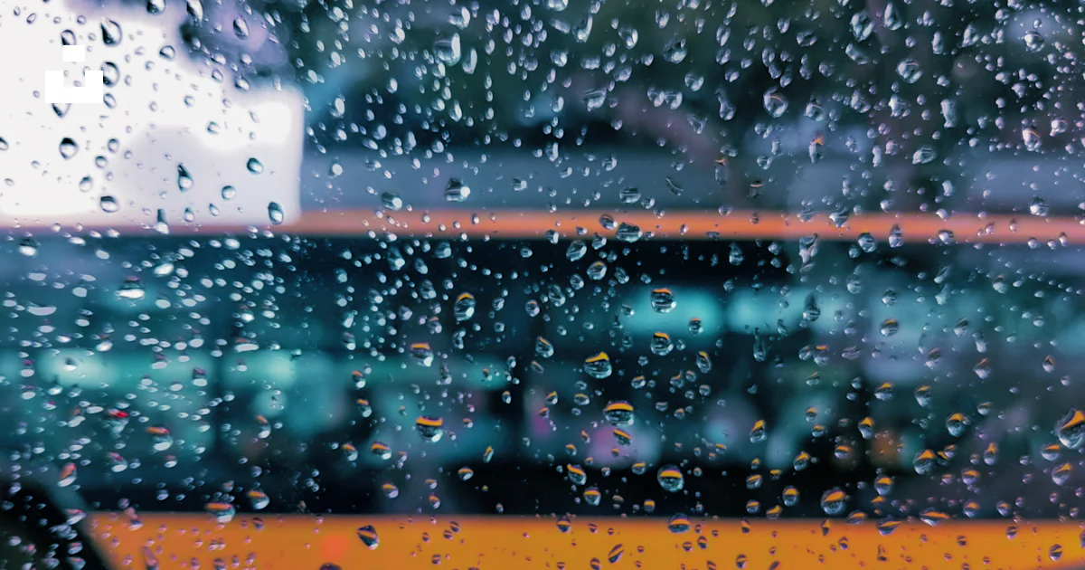 A view of a bus through a rain covered window photo – Free Bus Image on ...