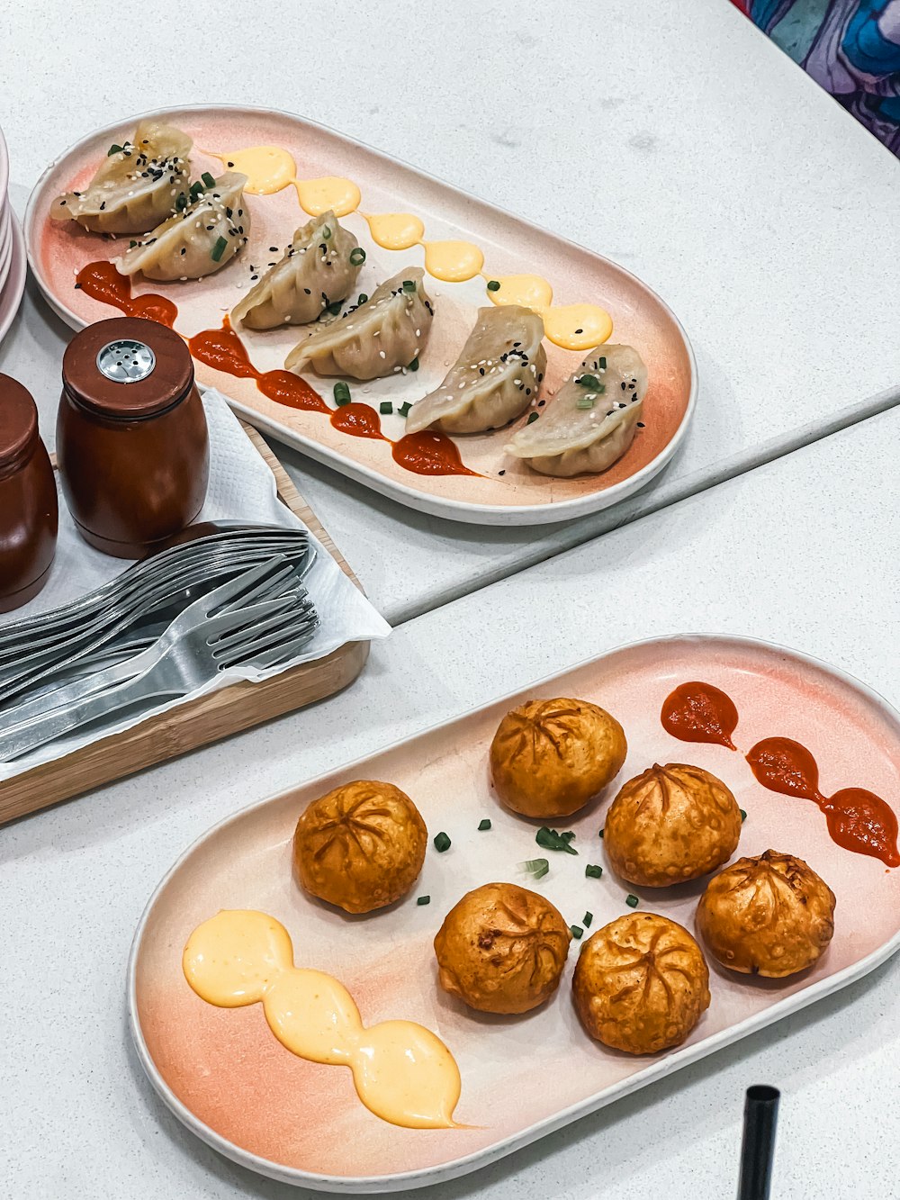 a couple of plates of food on a table