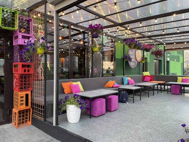 An outdoor patio area furnished with comfortable seating and vibrant cushions.