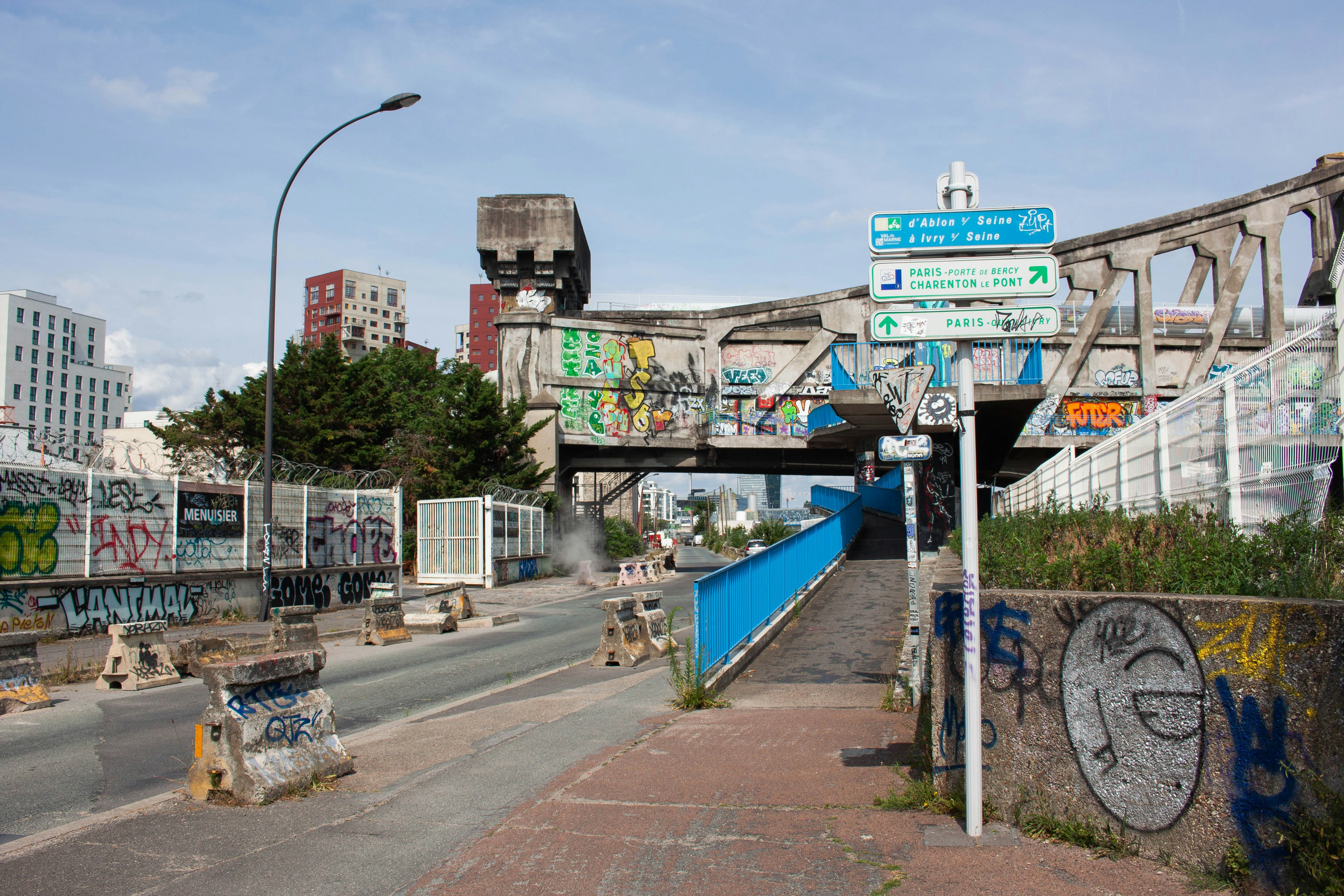 a city street with graffiti on the walls