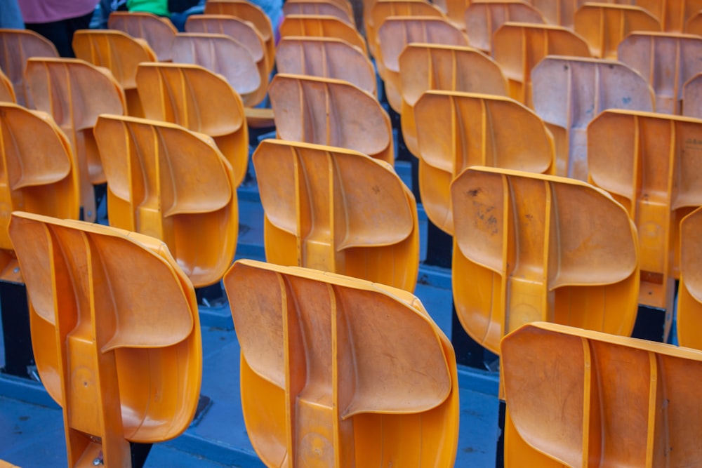 rows of empty chairs sitting in a stadium