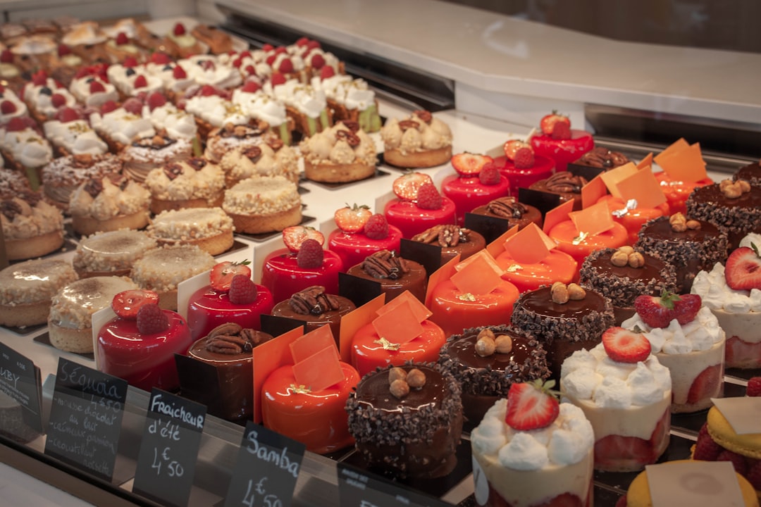 a display case filled with lots of different types of desserts,