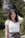 a woman posing for a picture in front of a mountain