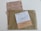 Three envelopes and a voting ballot are arranged on a flat surface. The largest envelope is brown with a text reading 'Elecciones Voto por Correo' and a stamp indicating it is urgent. On top of it, there are two smaller envelopes, one white labeled 'Diputados/as' and one beige labeled 'Senadores/as'. The voting ballot is partially visible beneath the envelopes, providing options for different political parties.