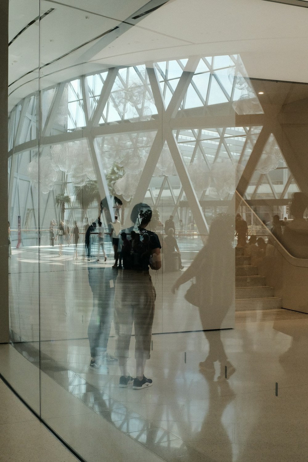 a group of people standing inside of a building