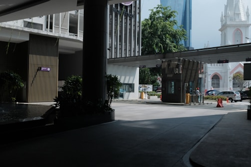 A secure, modern facility entrance with Umbrella Corp. signage in Racoon City.