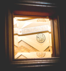 A beautifully designed certificate with Islamic geometric patterns.