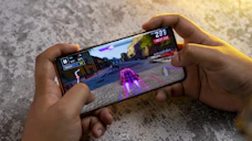 a person playing a game on a cell phone