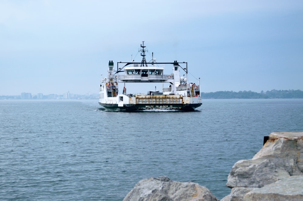 a ferry boat traveling across a large body of water