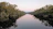 A serene riverside scene at sunrise, symbolizing peace and spiritual renewal.