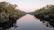 A serene riverside scene at sunrise, symbolizing peace and spiritual renewal.