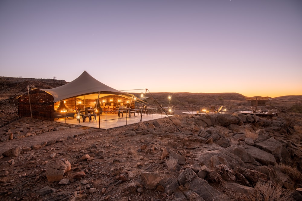 a tent set up in the middle of a desert