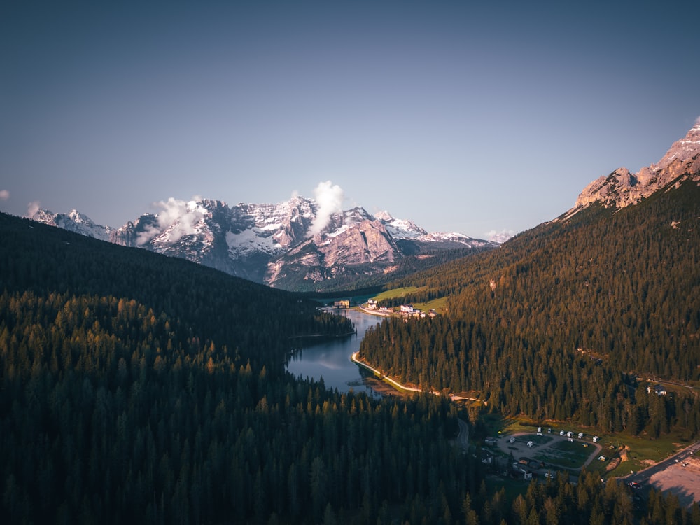 a view of a mountain range with a lake in the foreground