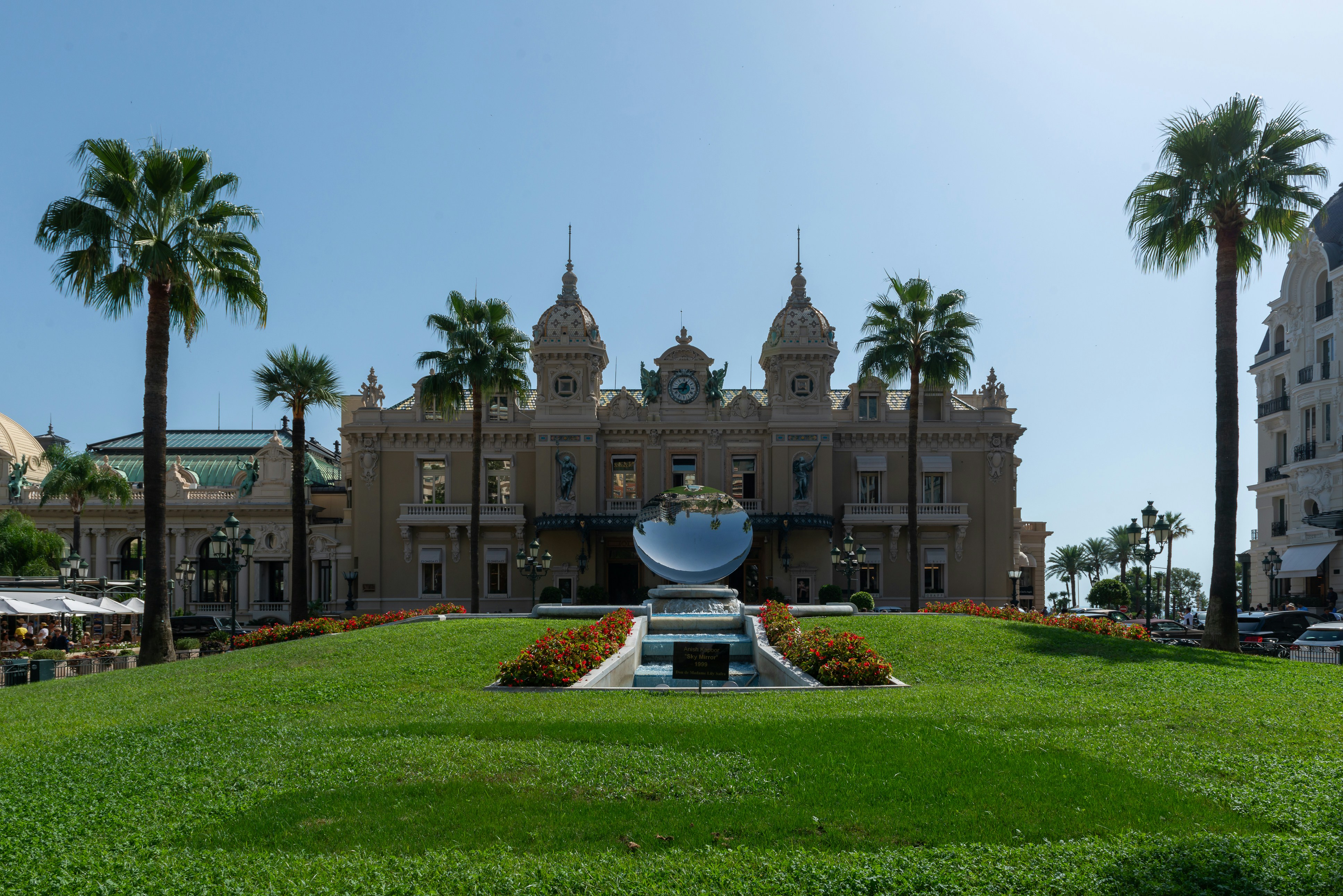 a large building with a fountain in front of it