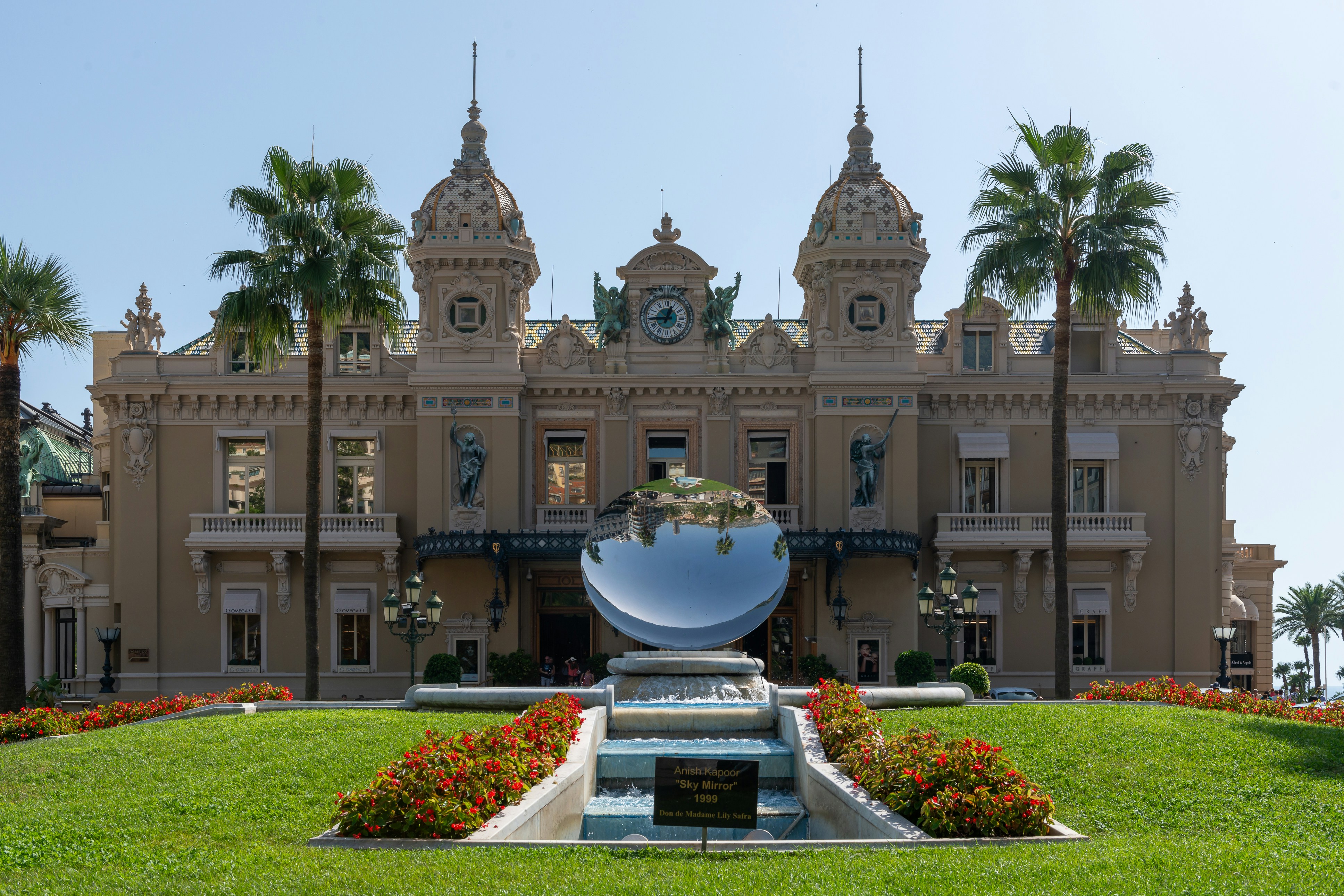 a large building with a fountain in front of it