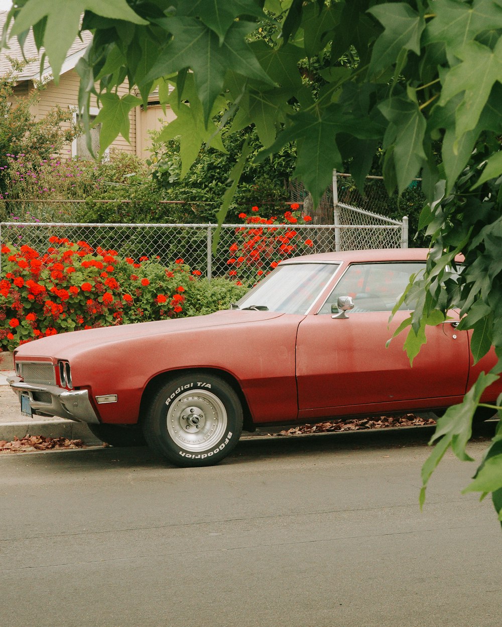 a red car parked on the side of the road