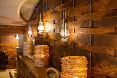 Warm lighting highlighting the restaurant’s earthy color palette with olive, brown, and brick red accents.