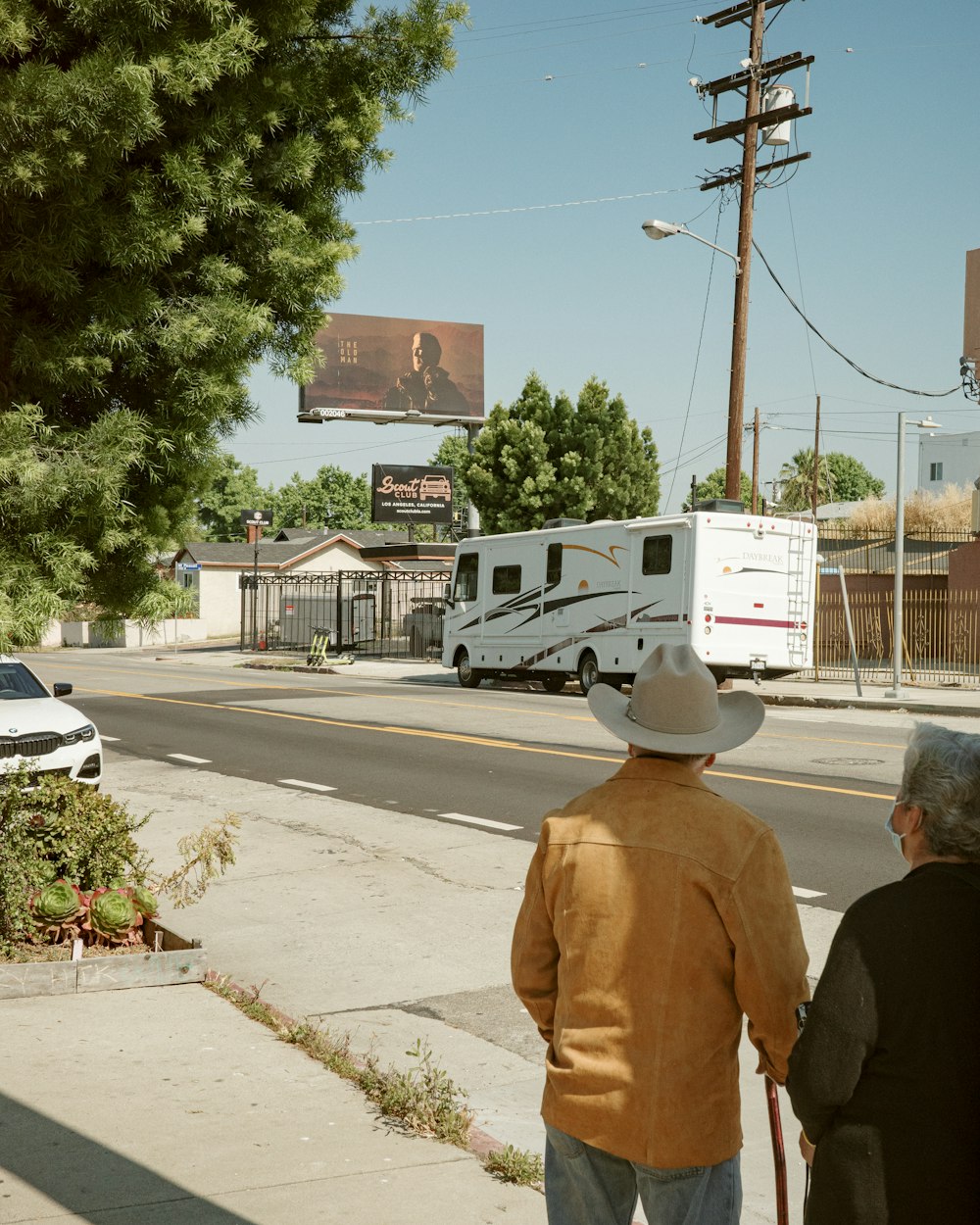 a couple of people that are walking down the street