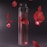 a glass vase filled with water and red petals
