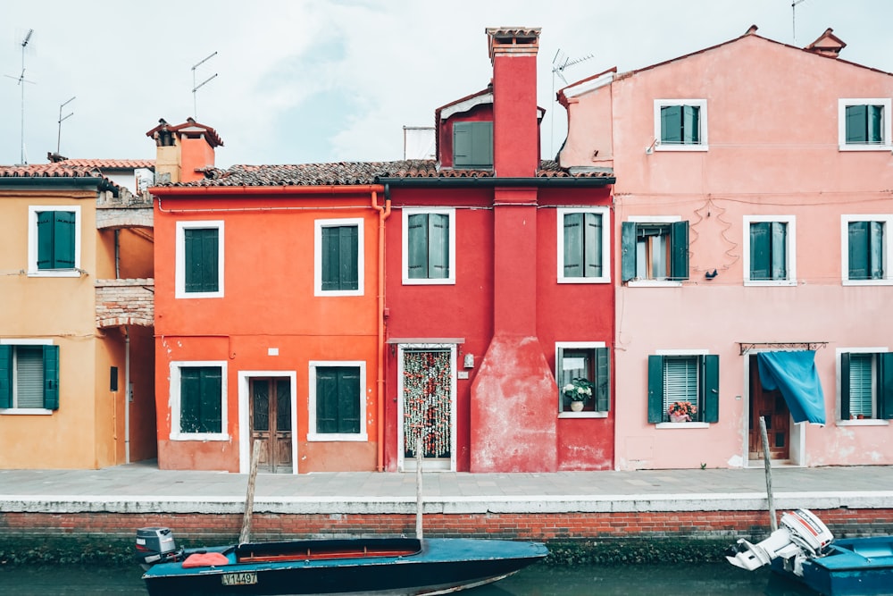 a row of houses next to a body of water