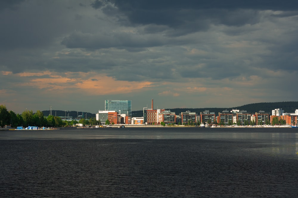 a large body of water with a city in the background