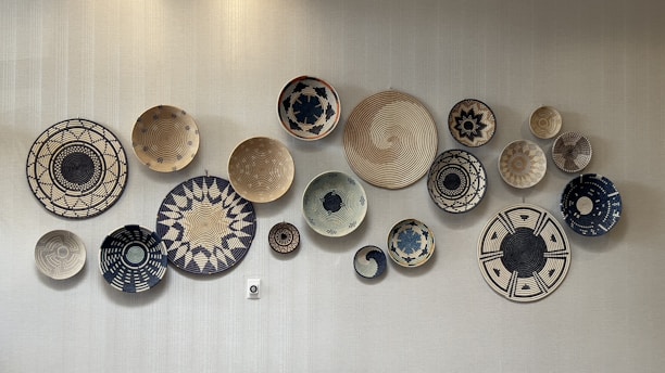 A collection of beautifully crafted engraved tissue baskets in black and brown hues.