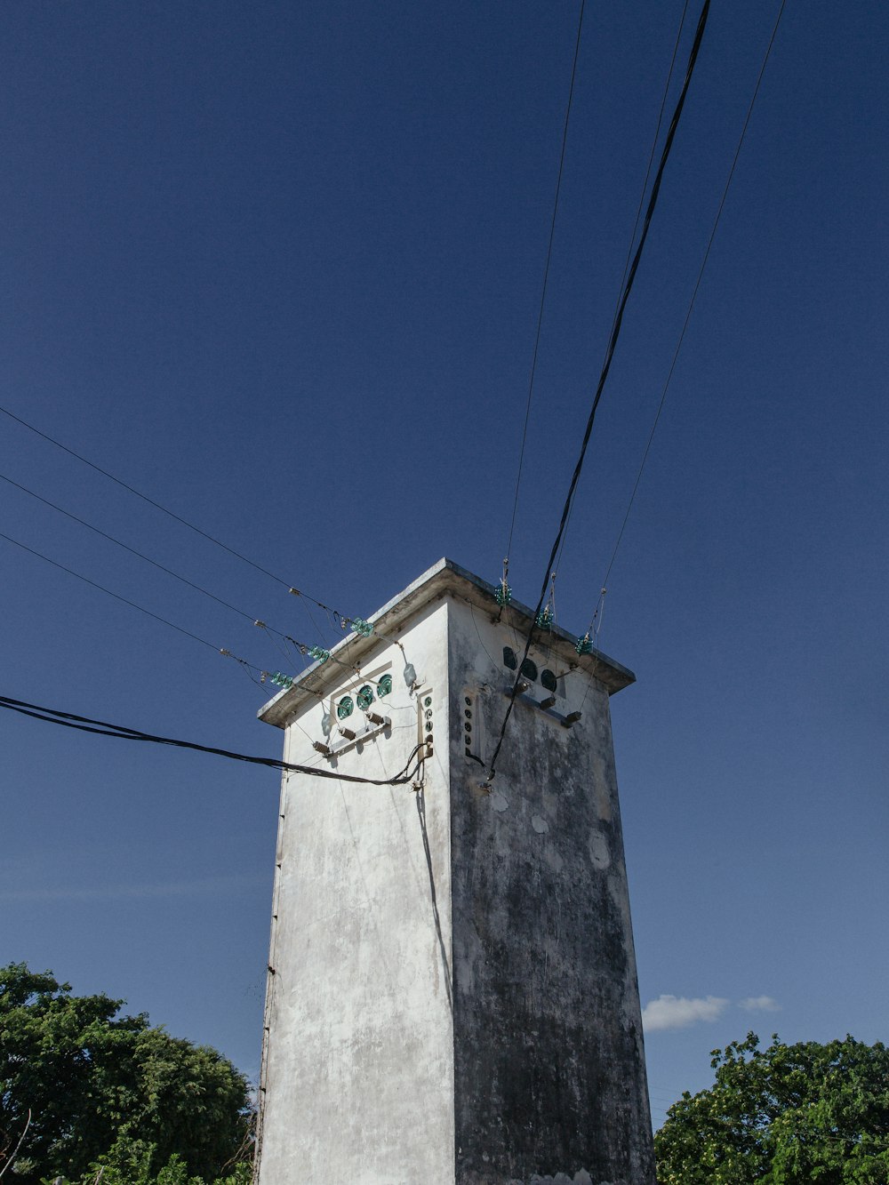 a tall tower with a clock on the top of it