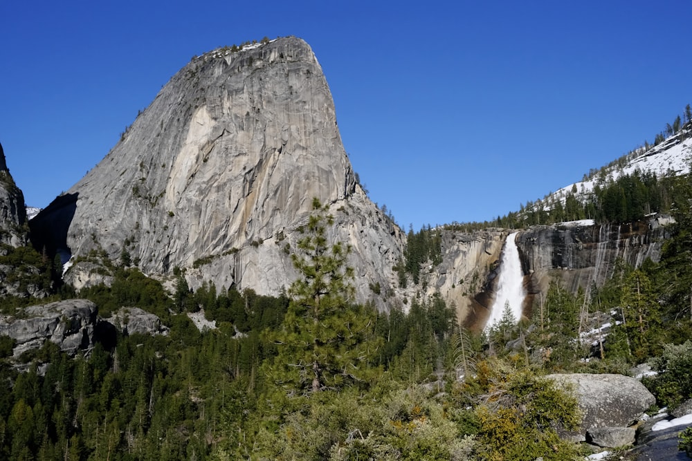 a mountain with a waterfall in the middle of it