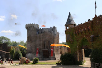 Medieval Minecraft castle with villagers and players engaging in activities