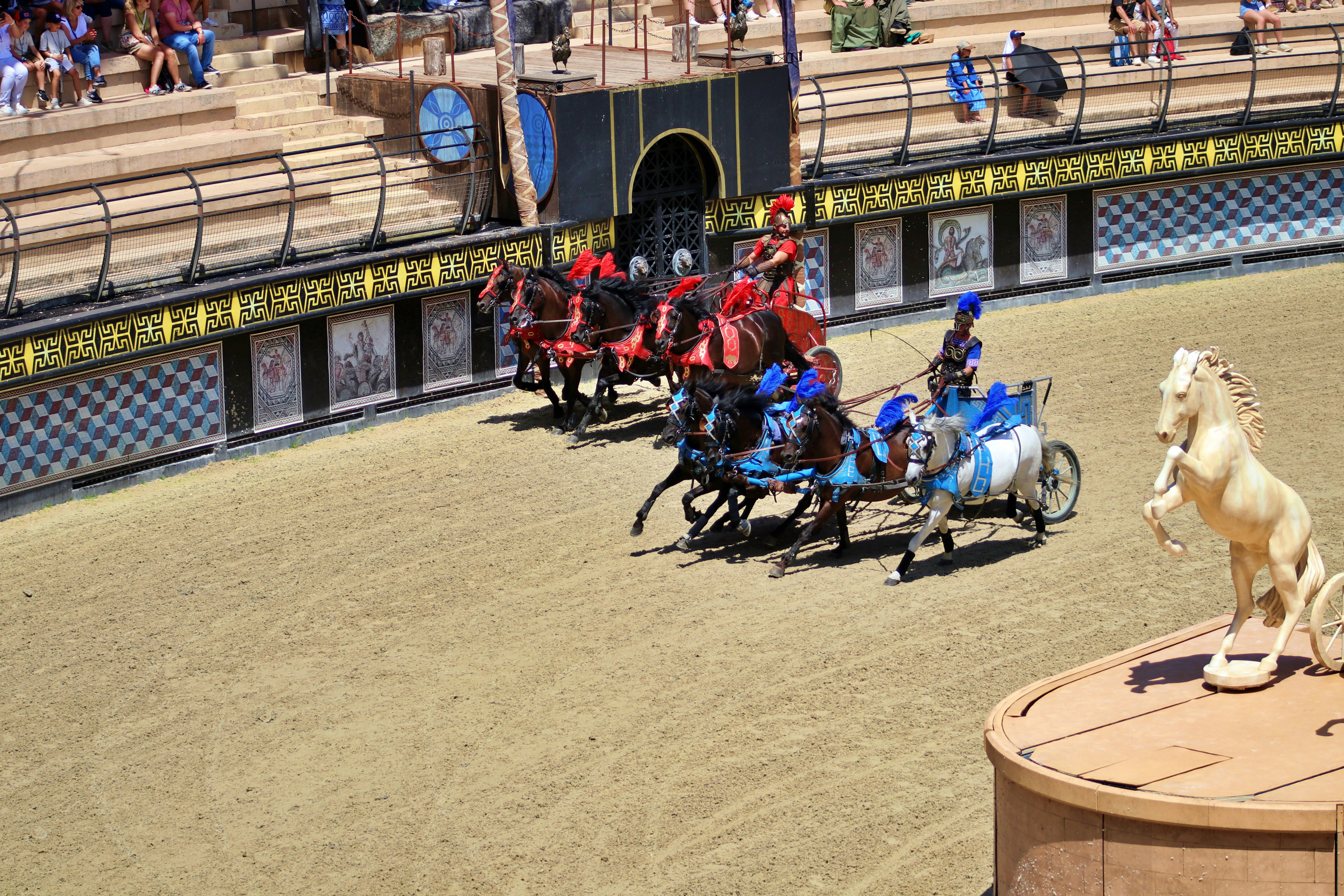 a group of men riding on the backs of horses