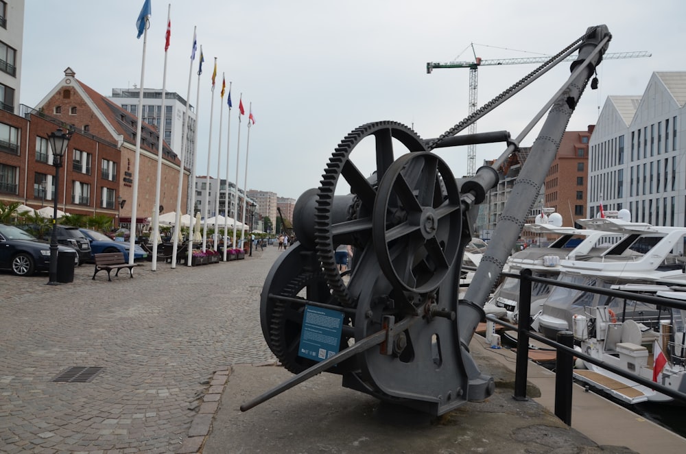 a large metal object sitting on top of a sidewalk