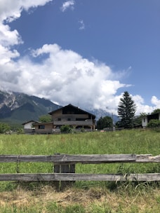 A freshly framed house standing tall amidst the scenic Flathead Valley landscape.