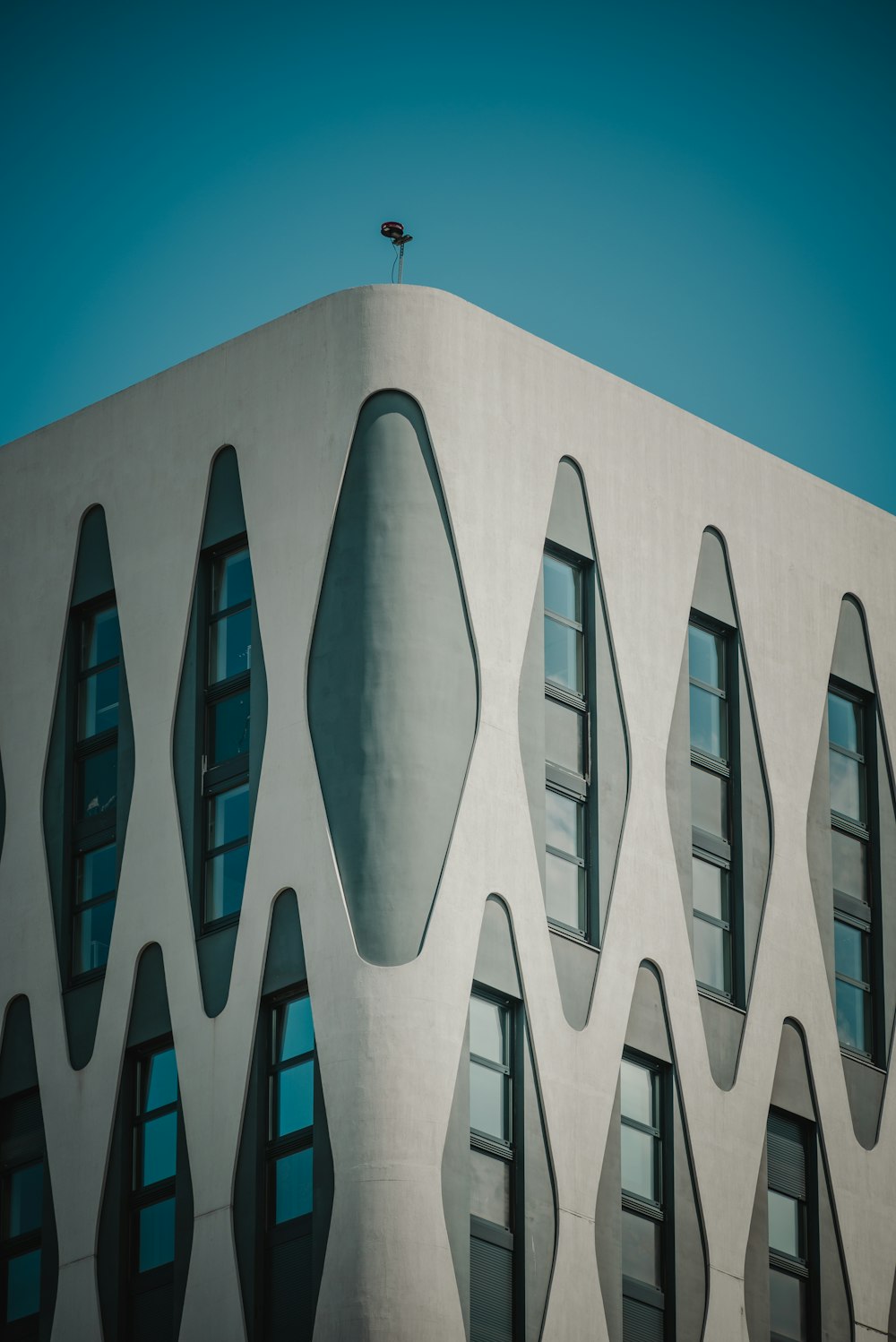 a building with a bird sitting on top of it