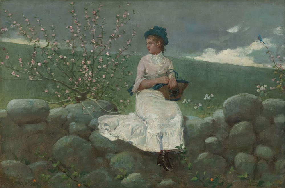 a painting of a woman sitting on a rock wall