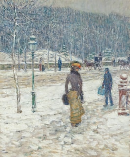 A winter scene with people walking in the snow. A woman dressed in an elegant coat and skirt stands out in the foreground, facing away with her face turned slightly to the side. Her outfit includes a hat with colorful decorations. Nearby, a young person holds a bright blue pail, wearing a coat. In the background are several more figures, trees without leaves, and a horse-drawn carriage. The atmosphere is serene, depicting a calm winter day.