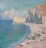 A coastal seascape depicting a tranquil beach with several small boats and colorful sails resting on the sand. Towering cliffs rise sharply at the right, while the crystal-clear blue-green sea stretches towards the horizon under a sky filled with soft, fluffy clouds.
