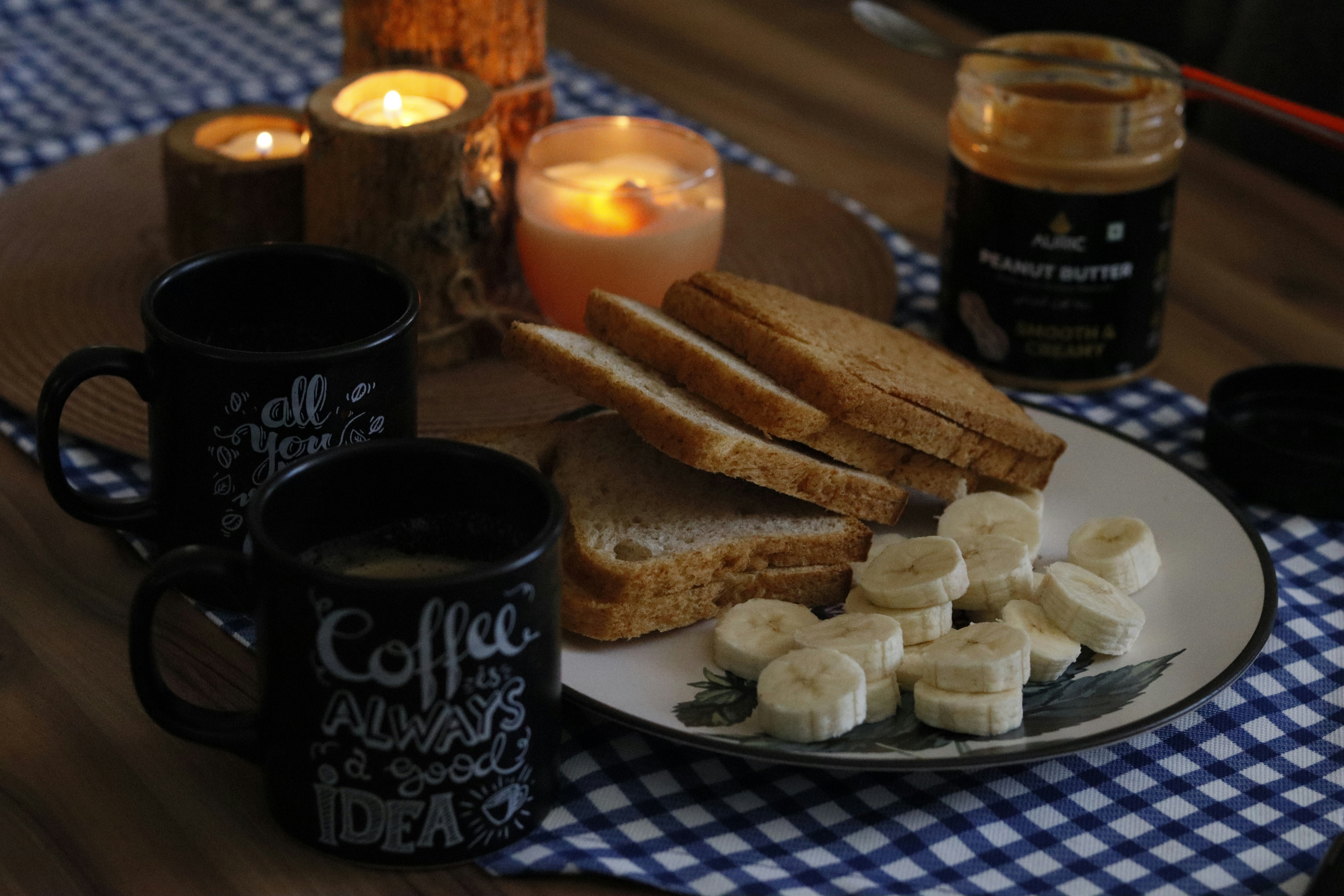 a plate topped with sliced bananas next to a cup of coffee
