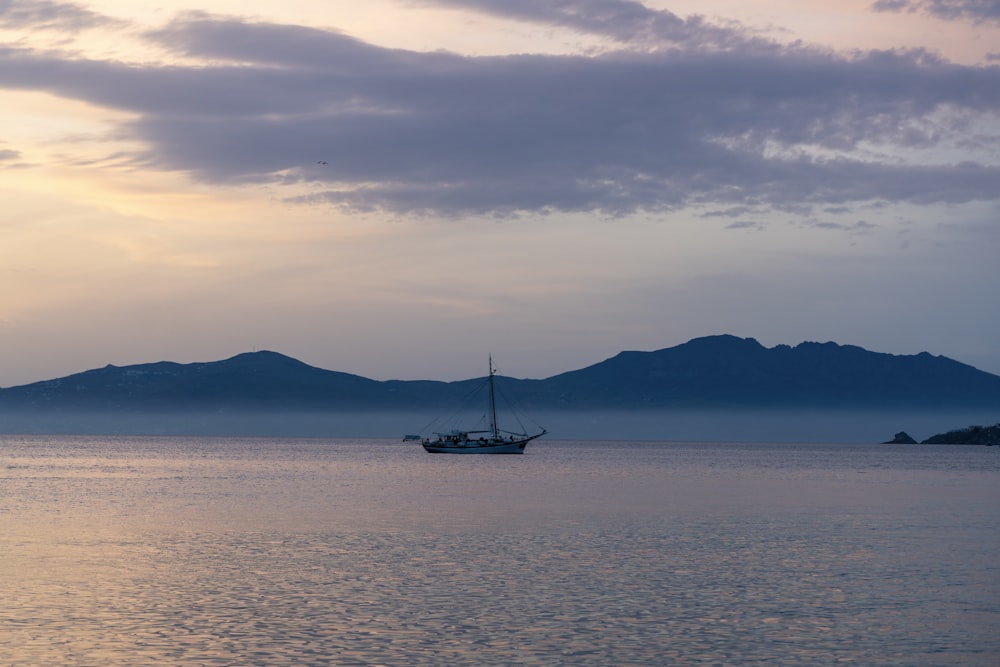 a boat floating on top of a large body of water