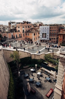 Balcony view overlooking a bustling city square.