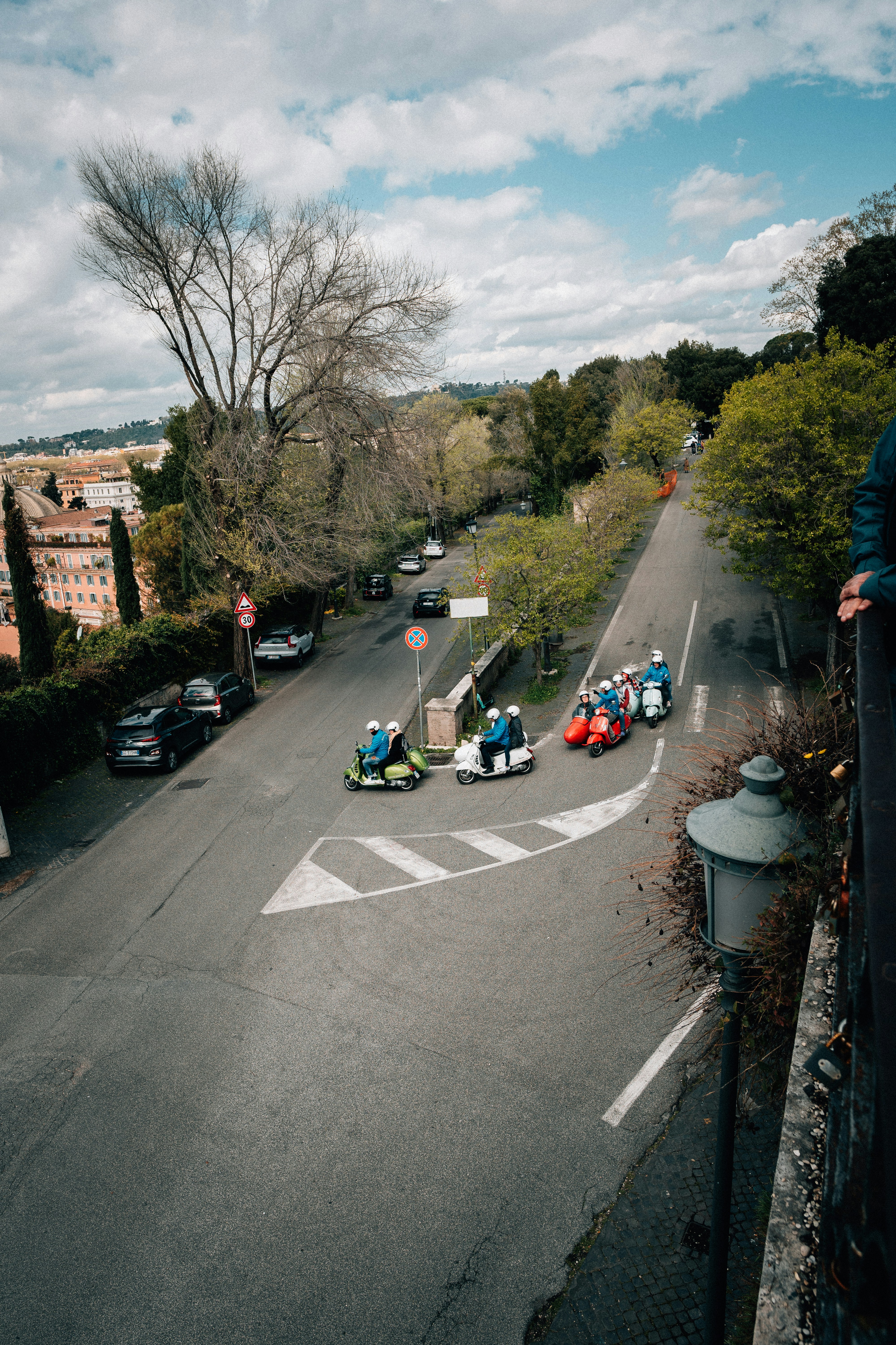 a group of people riding bumper cars down a street