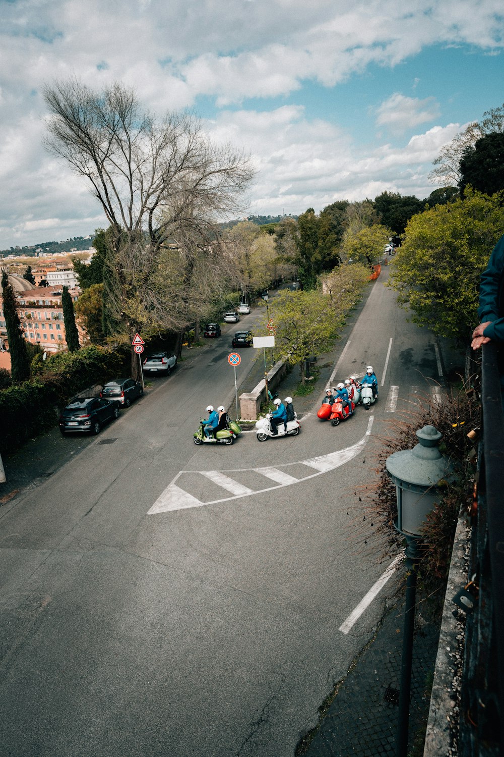 a group of people riding bumper cars down a street